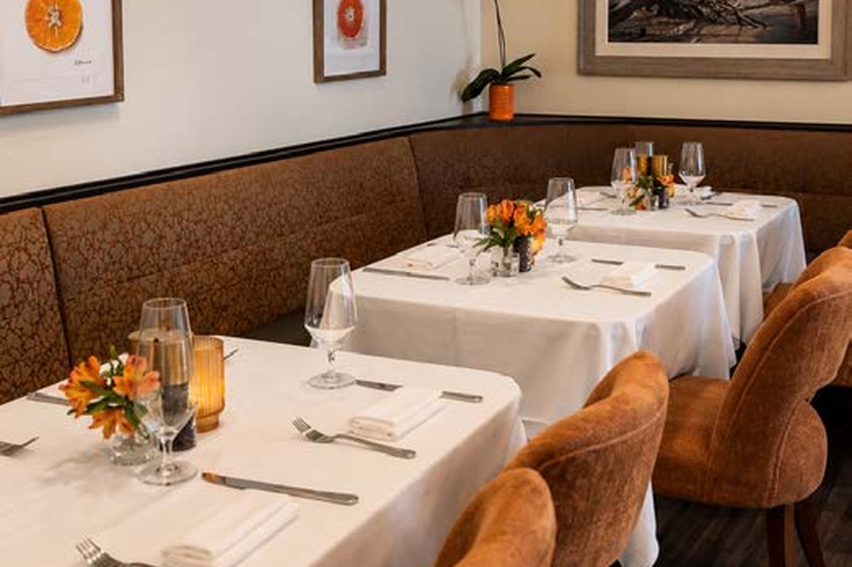 Deep Water Room intimate indoor dining space with banquette seating